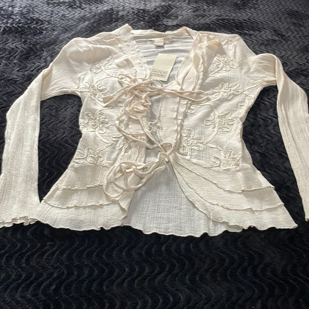 Cream top with lace front ties and side embroidery